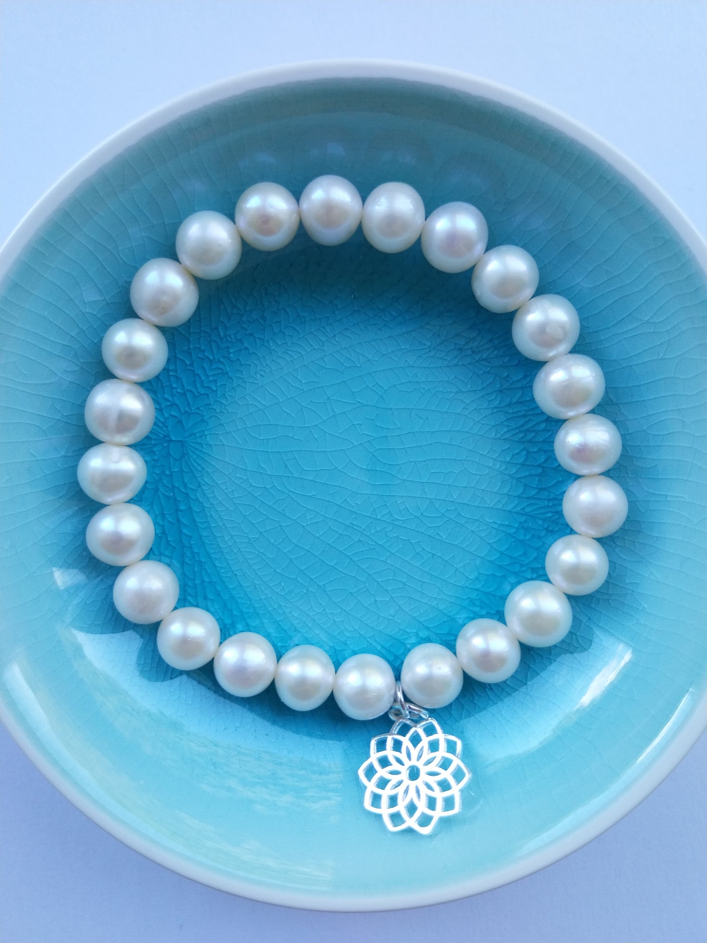 Pearl bracelet with crown chakra silver charm