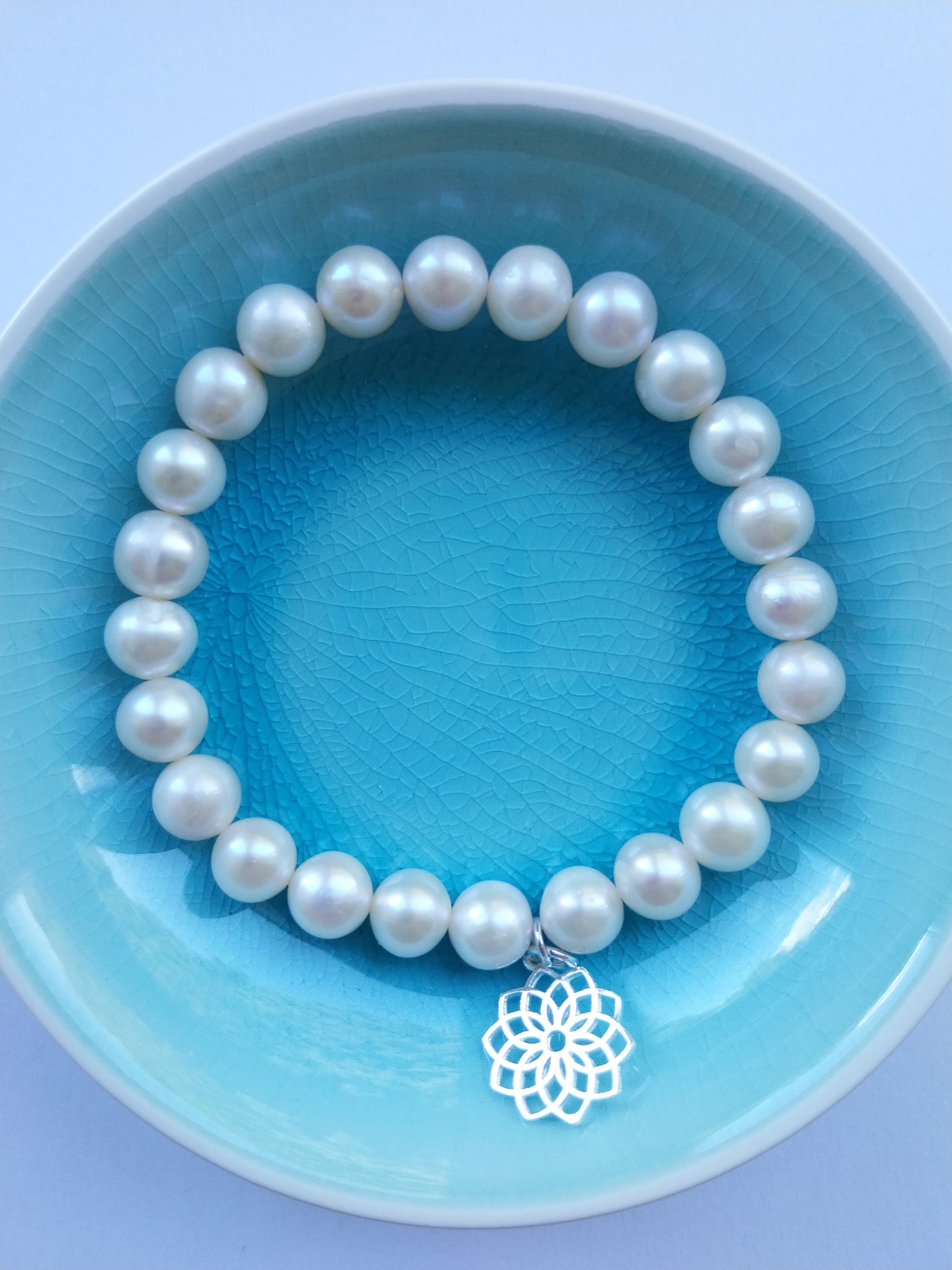 Pearl bracelet with crown chakra silver charm