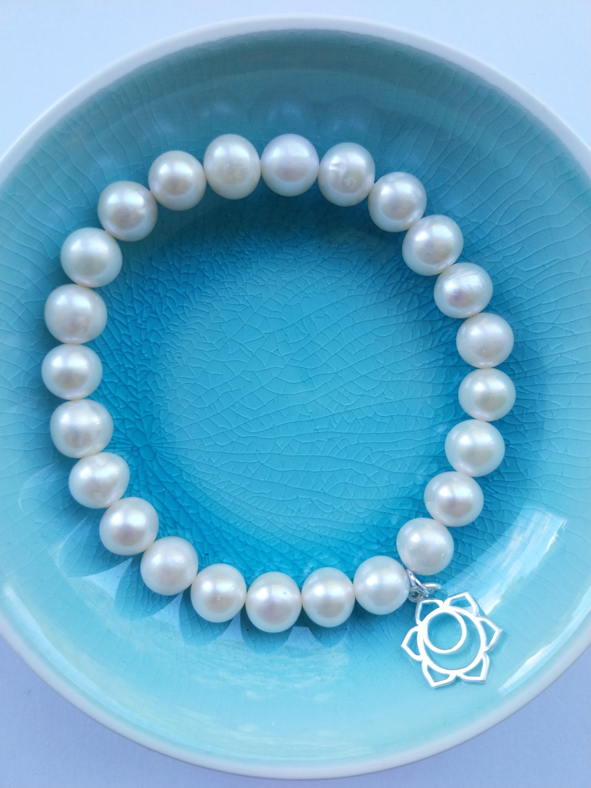 Pearl bracelet with sacral chakra sterling silver charm