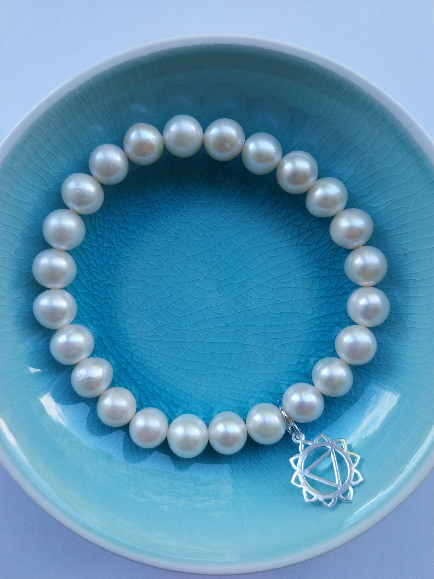 Pearl bracelet with solar plexus chakra silver charm