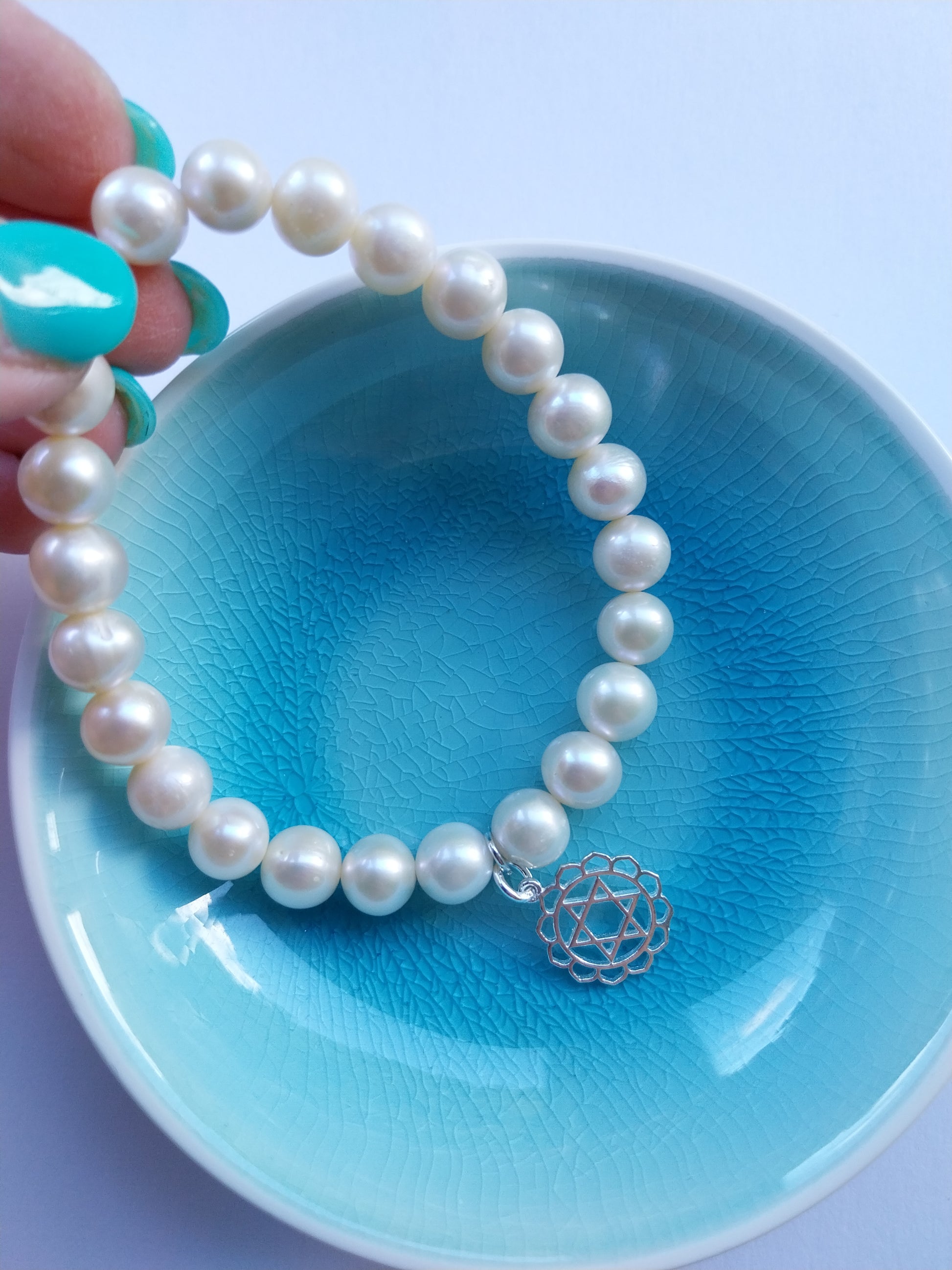 Pearl bracelet with sterling silver heart chakra charm