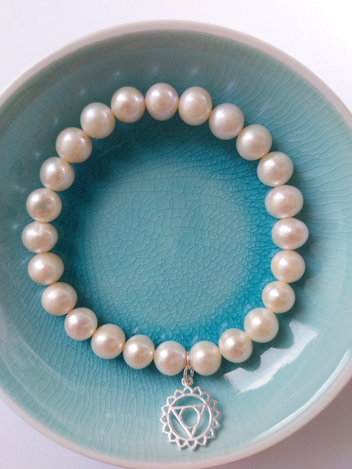 Pearl bracelet with throat chakra sterling silver charm