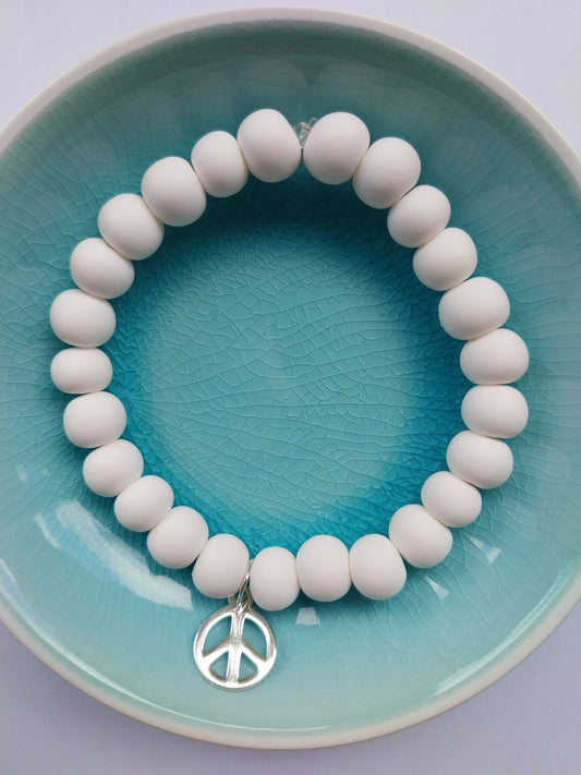 White clay bead bracelet with sterling silver peace charm