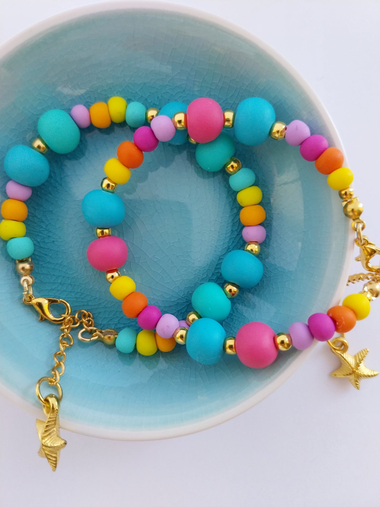 Multi-coloured polymer clay bead bracelets with gold plated clasp and starfish charm