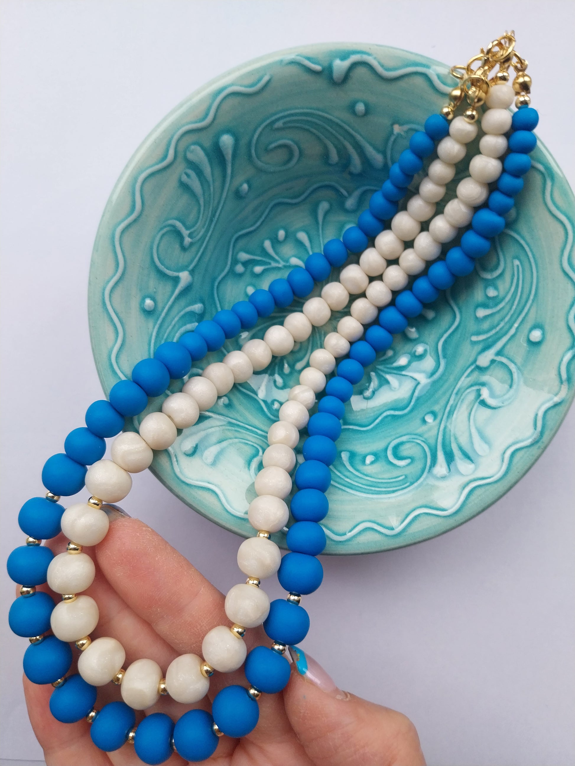 Blue and mother of pearl effect necklaces