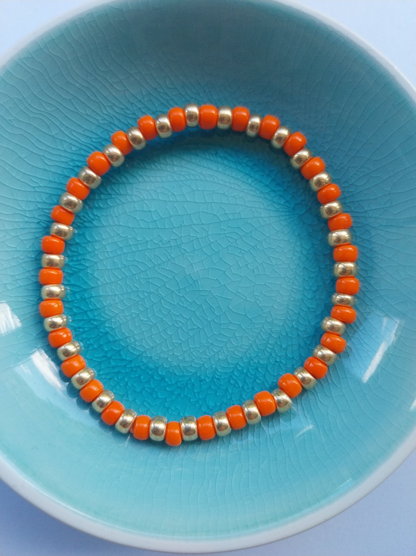 Elasticated bracelet - orange and gold