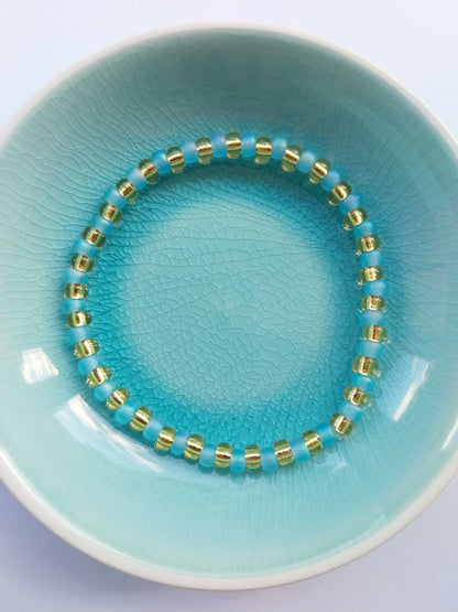 Elasticated bracelet - orange and gold