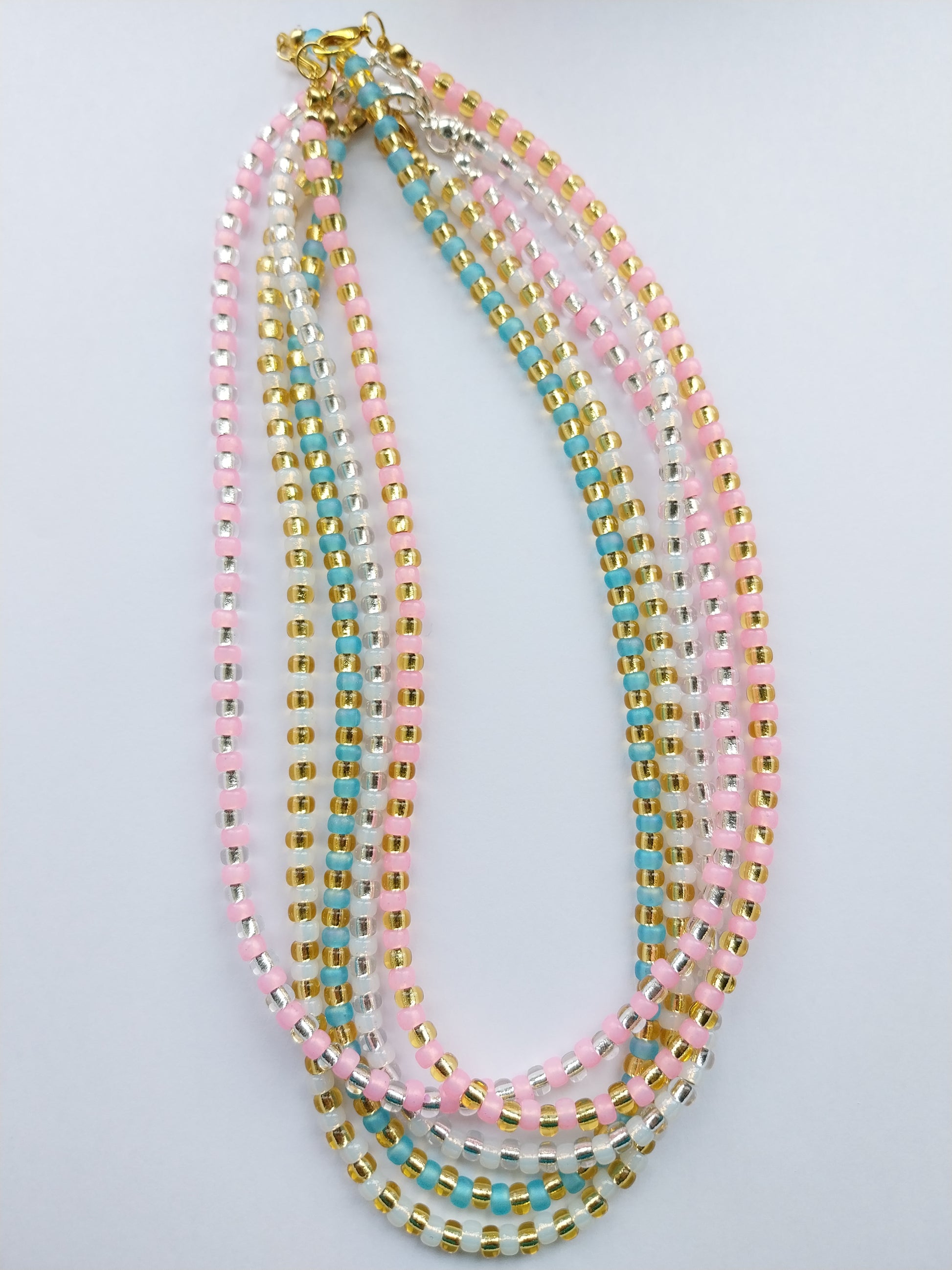 Glass bead necklaces in pastel colours