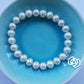 Pearl bracelet featuring third eye chakra sterling silver charm
