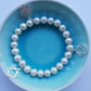 Pearl bracelet with 3 chakra silver charms