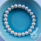 Pearl bracelet with heart chakra silver charm