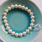Pearl bracelet with root chakra sterling silver charm