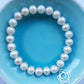 Pearl bracelet with sacral chakra sterling silver charm