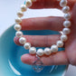 Pearl bracelet with sacral chakra silver charm