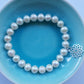 Pearl bracelet with sterling silver crown chakra charm