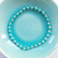 Teal and crystal glass bead elasticated bracelet