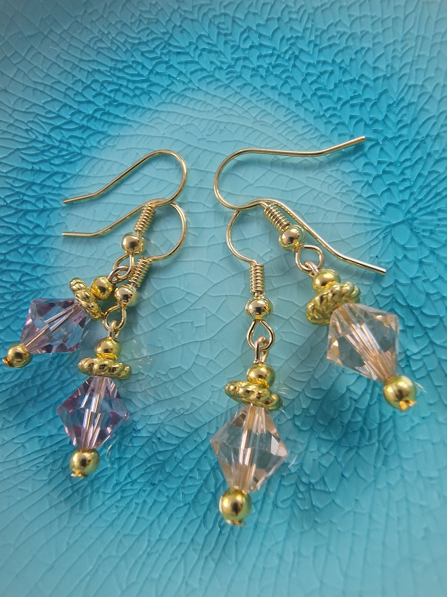Swarovski gold earrings in lavender and light peach colours