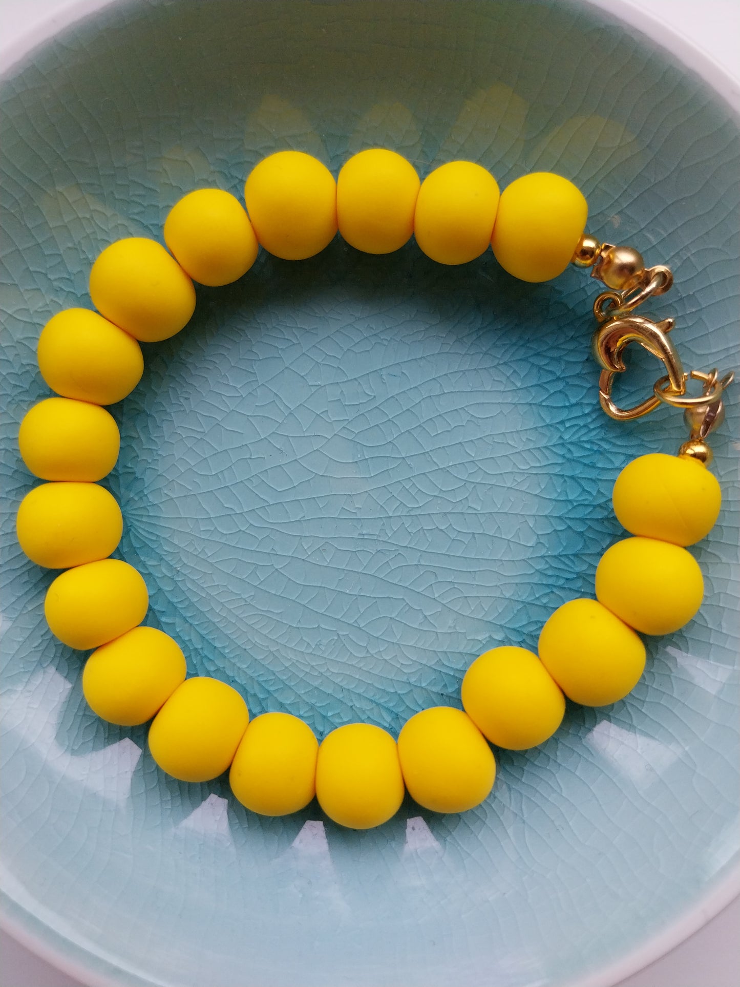 vibrant yellow polymer clay bead bracelet with heart shaped clasp