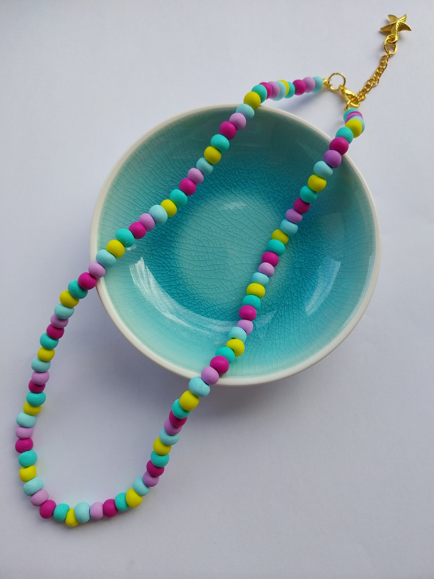 Multi-coloured clay bead necklace with starfish charm